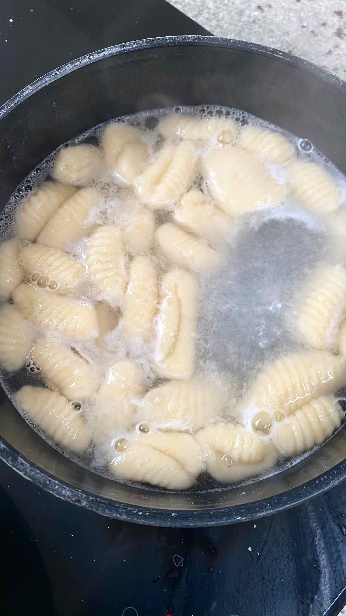 Boiling gnocchi in a pot