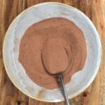 Hot chocolate dry mix in a bowl with a spoon