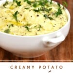Mashed potatoes topped with black pepper and herbs