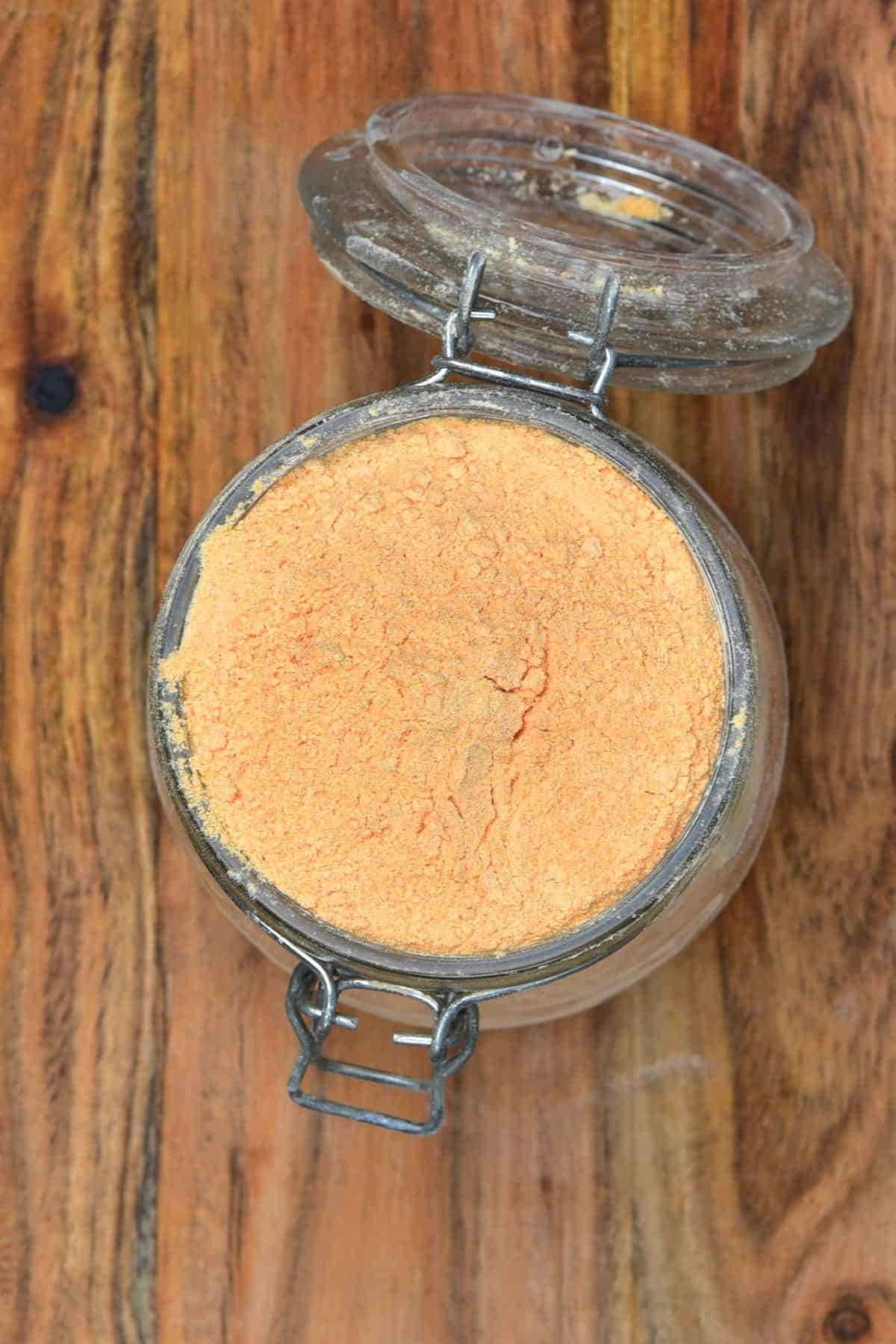 Top view of a jar full with red lentil flour