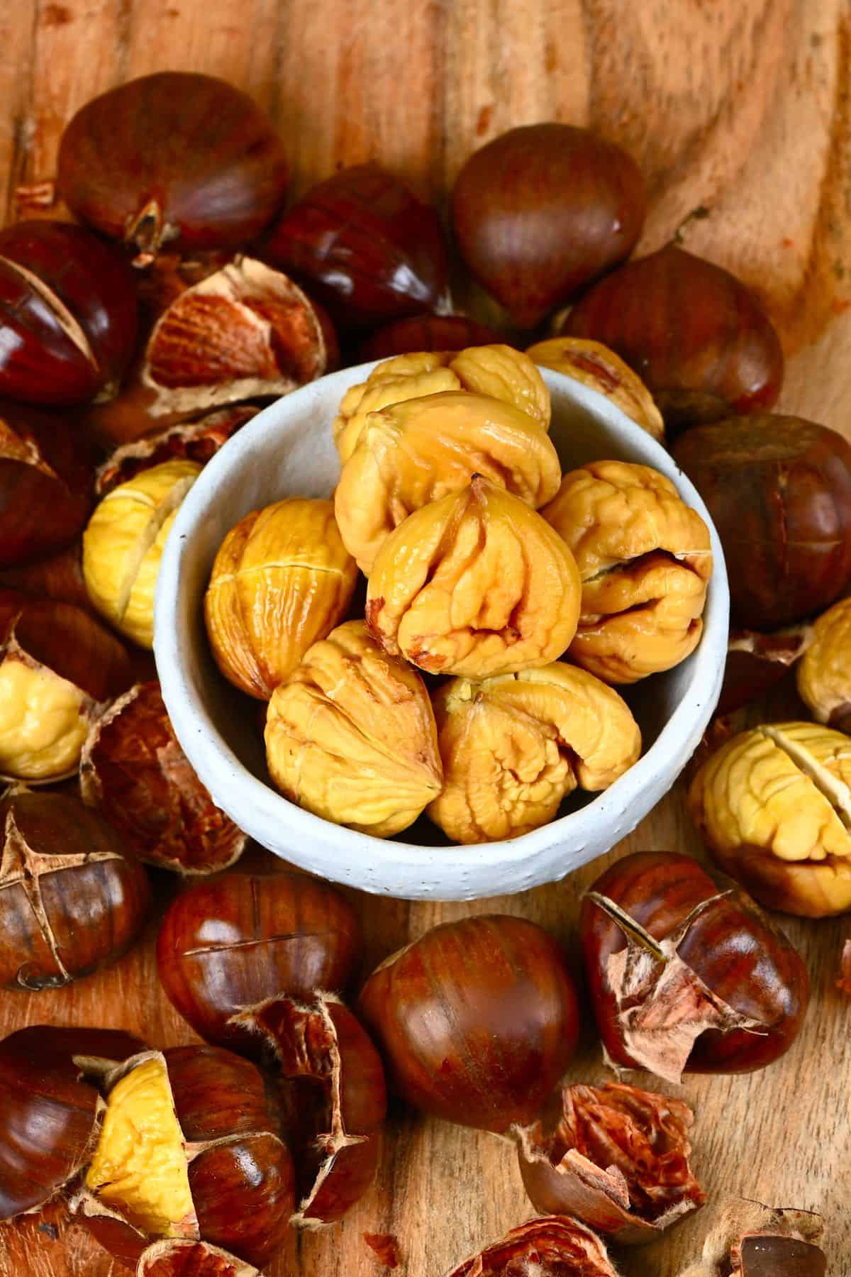 Peeled roasted chestnuts in a small bowl