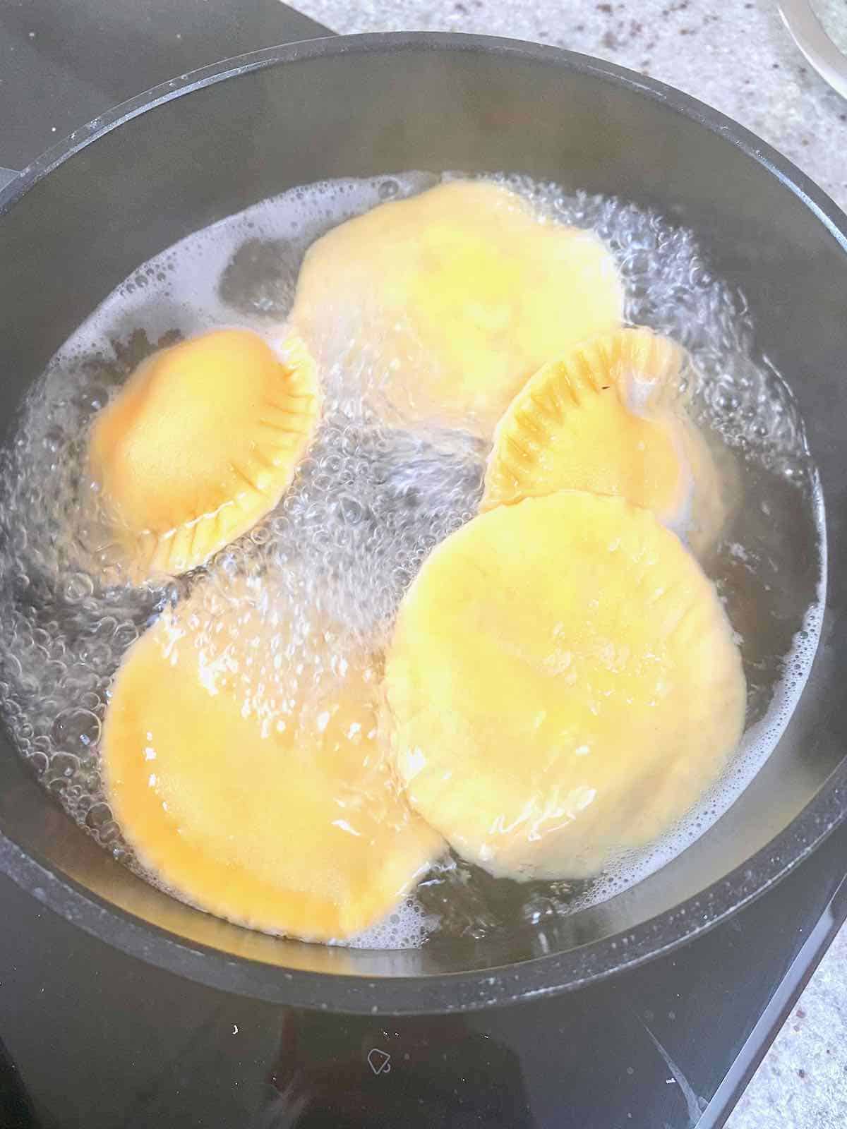 Boiling ravioli in a pot