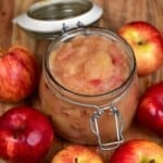 A jar with Applesauce and a few apples around it - 14