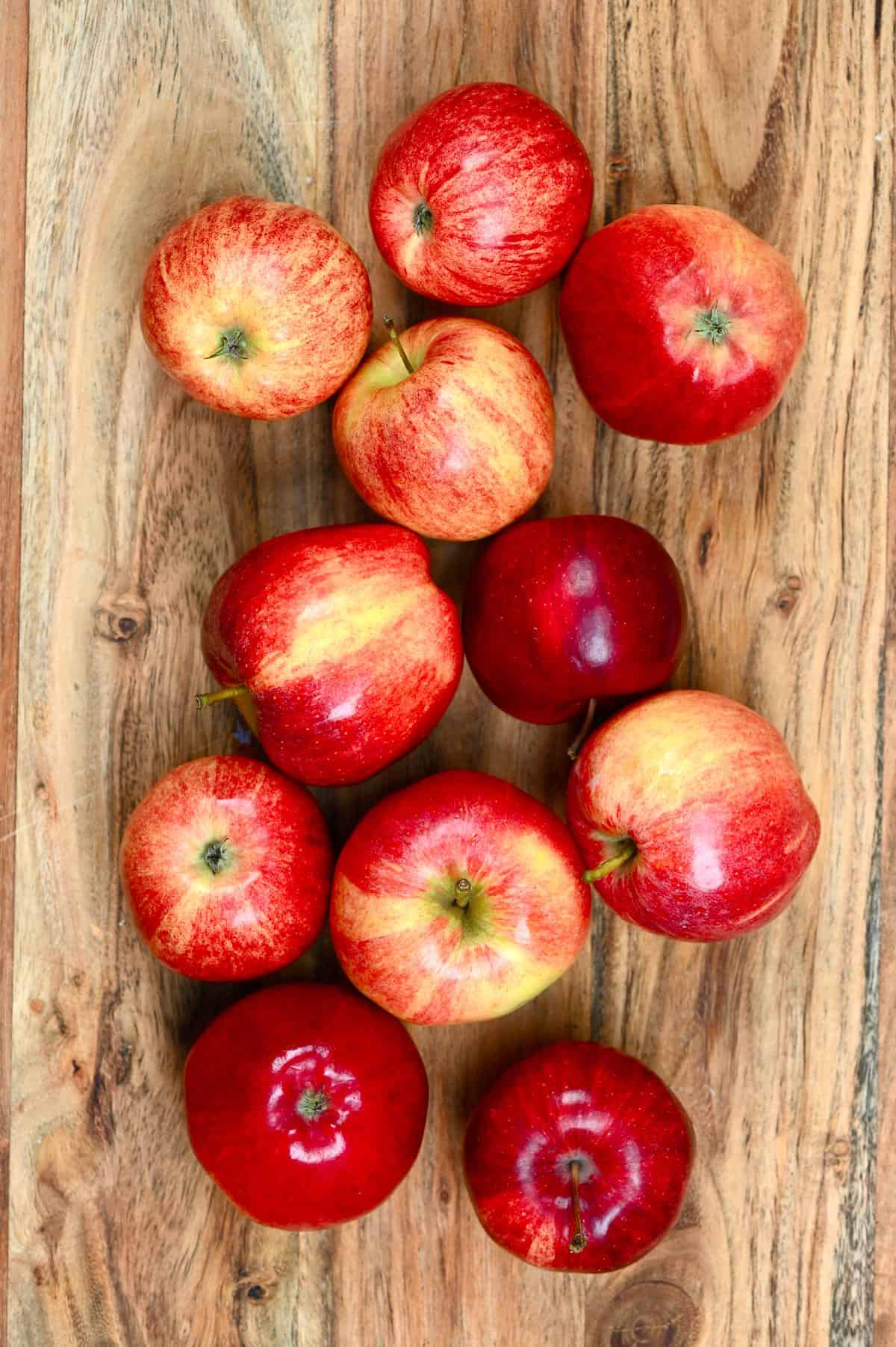 A few apples on a wooden board