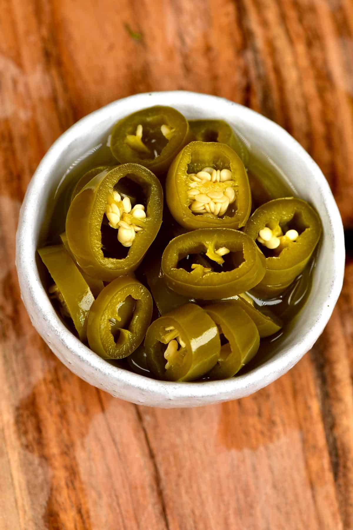 Pickled jalapeños in a small bowl