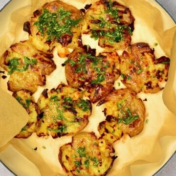 Baked smashed potatoes in an oven dish