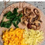 Breakfast tortilla with spinach, mushroom and scrambled eggs