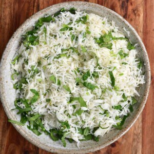 A bowl of basmati rice mixed with cilantro