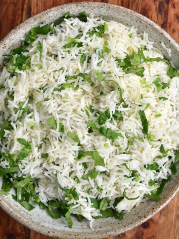 A bowl of basmati rice mixed with cilantro