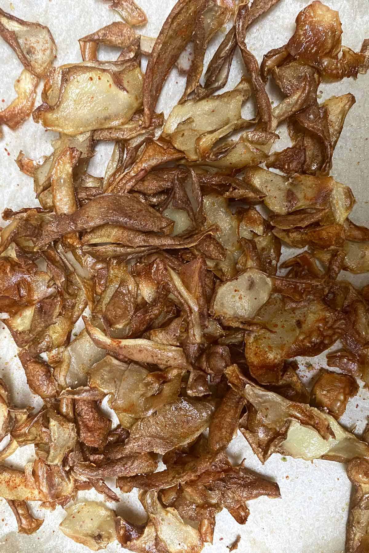 Potato peel chips on a flat surface