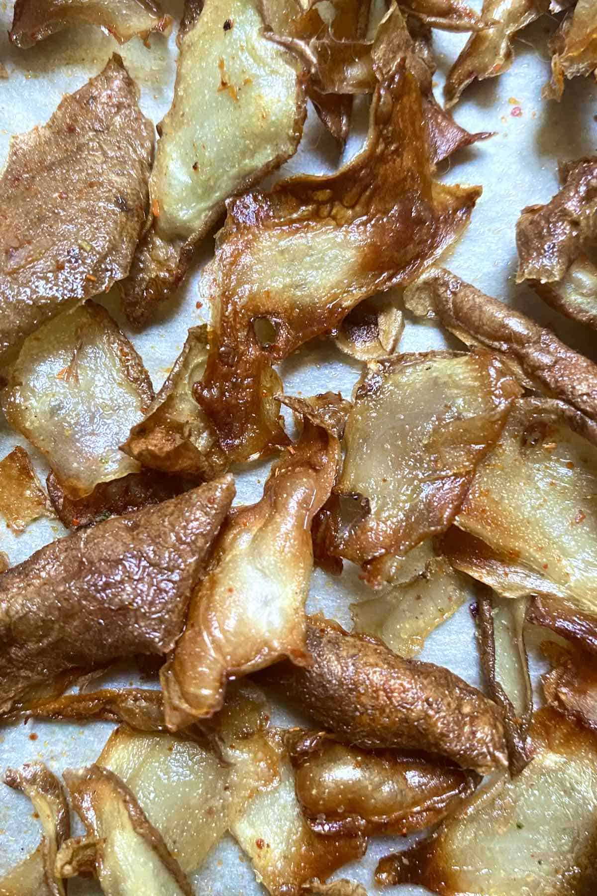 A close up of Potato peel chips on a flat surface