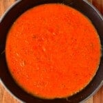 A pan with roasted red tomato sauce - 31