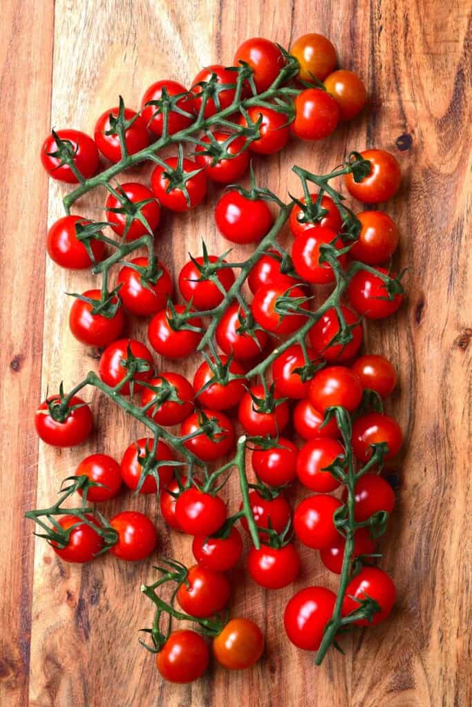 Cherry tomatoes on a wooden chopping board