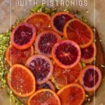 Blood orange cake with pistachios and candied orange slices on top