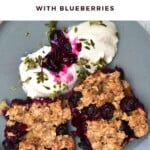 Two slices of Blueberry Baked Oatmeal with yogurt served in a plate