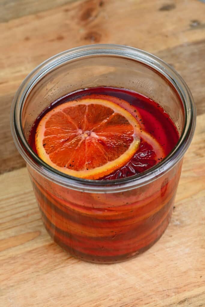 Candied orange slices in a jar with syrup