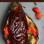 Baked eggplant stuffed with tomatoes and garlic