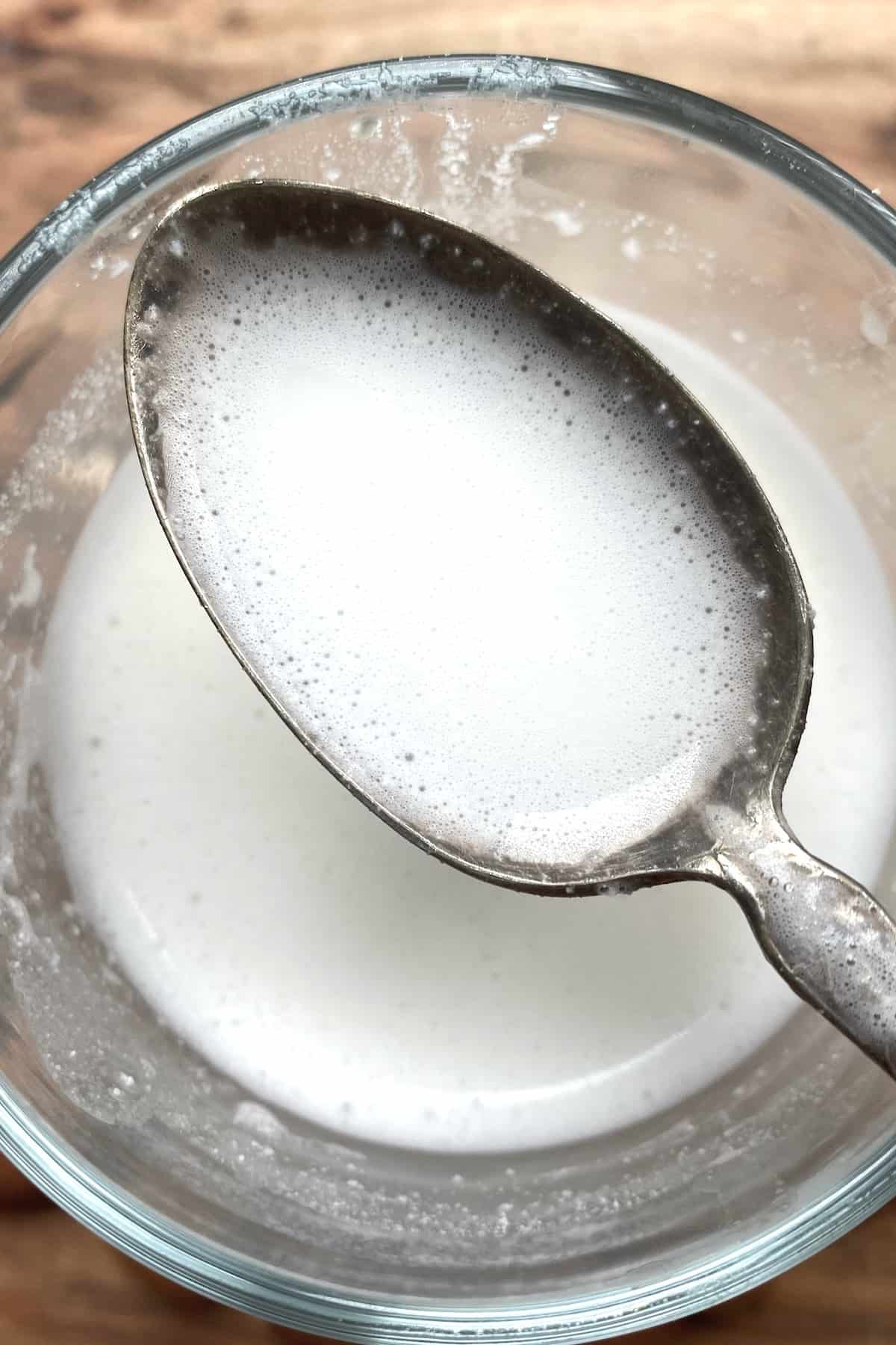 A spoonful of creamy instant almond milk