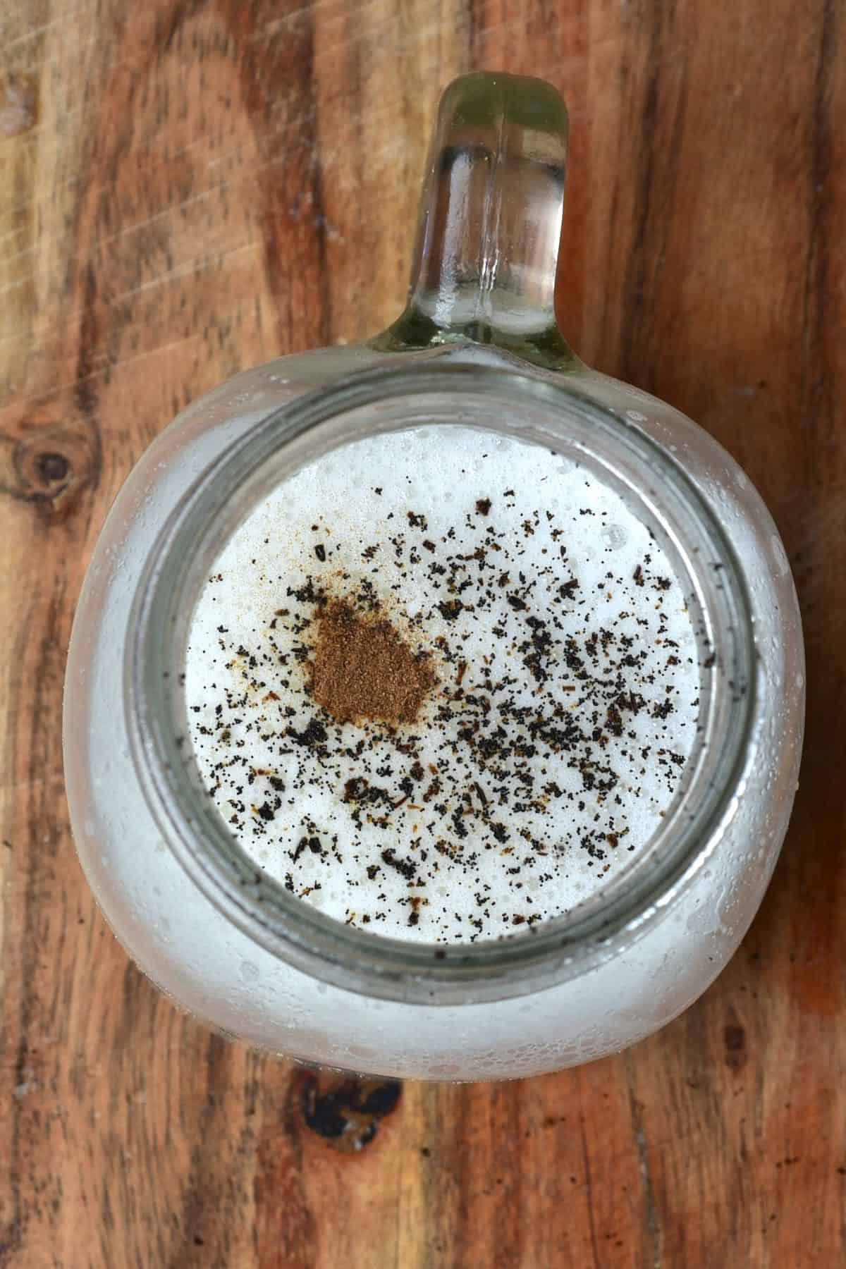 A glass with almond butter with vanilla and cinnamon