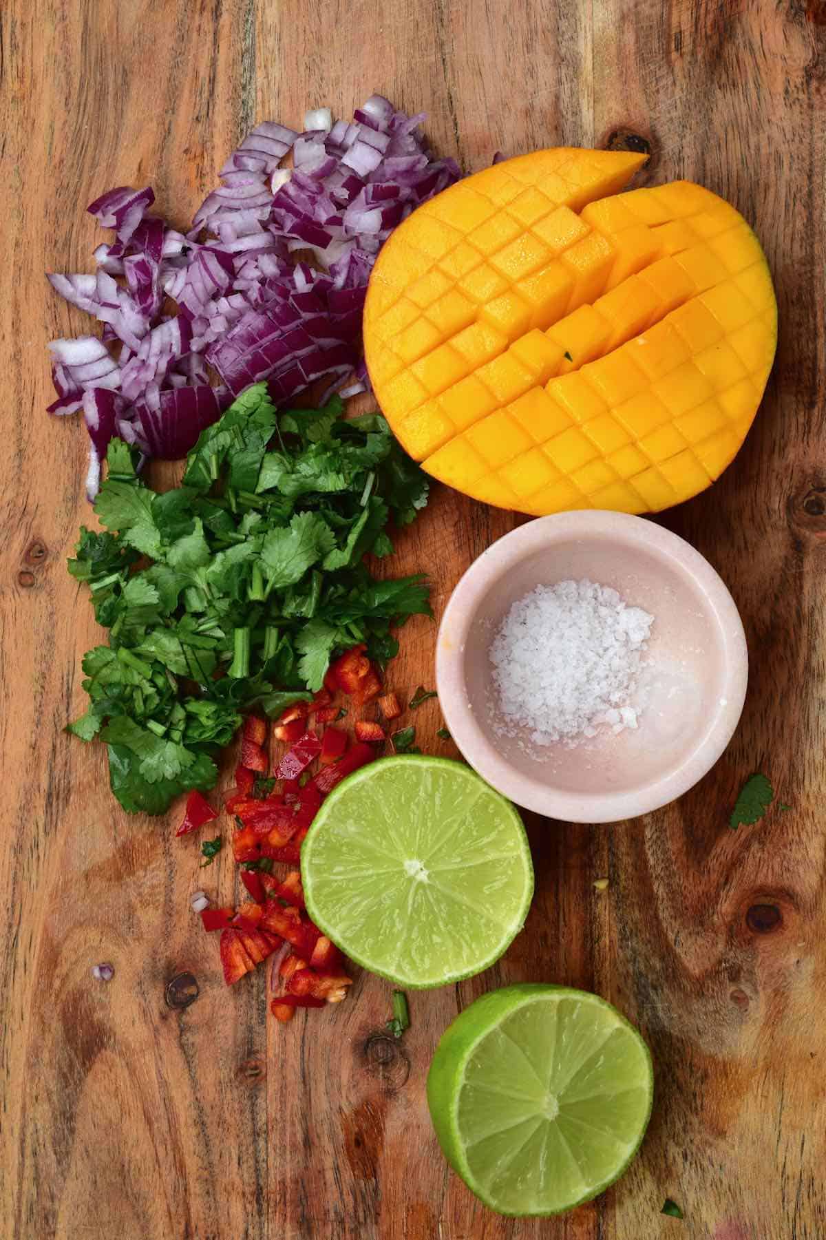 Chopped ingredients for mango and cilantro salsa