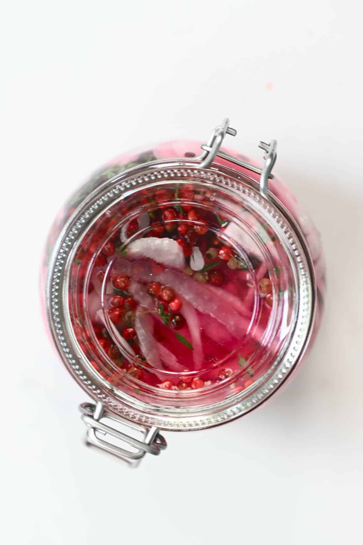 Top view of closed jar with pickled onions