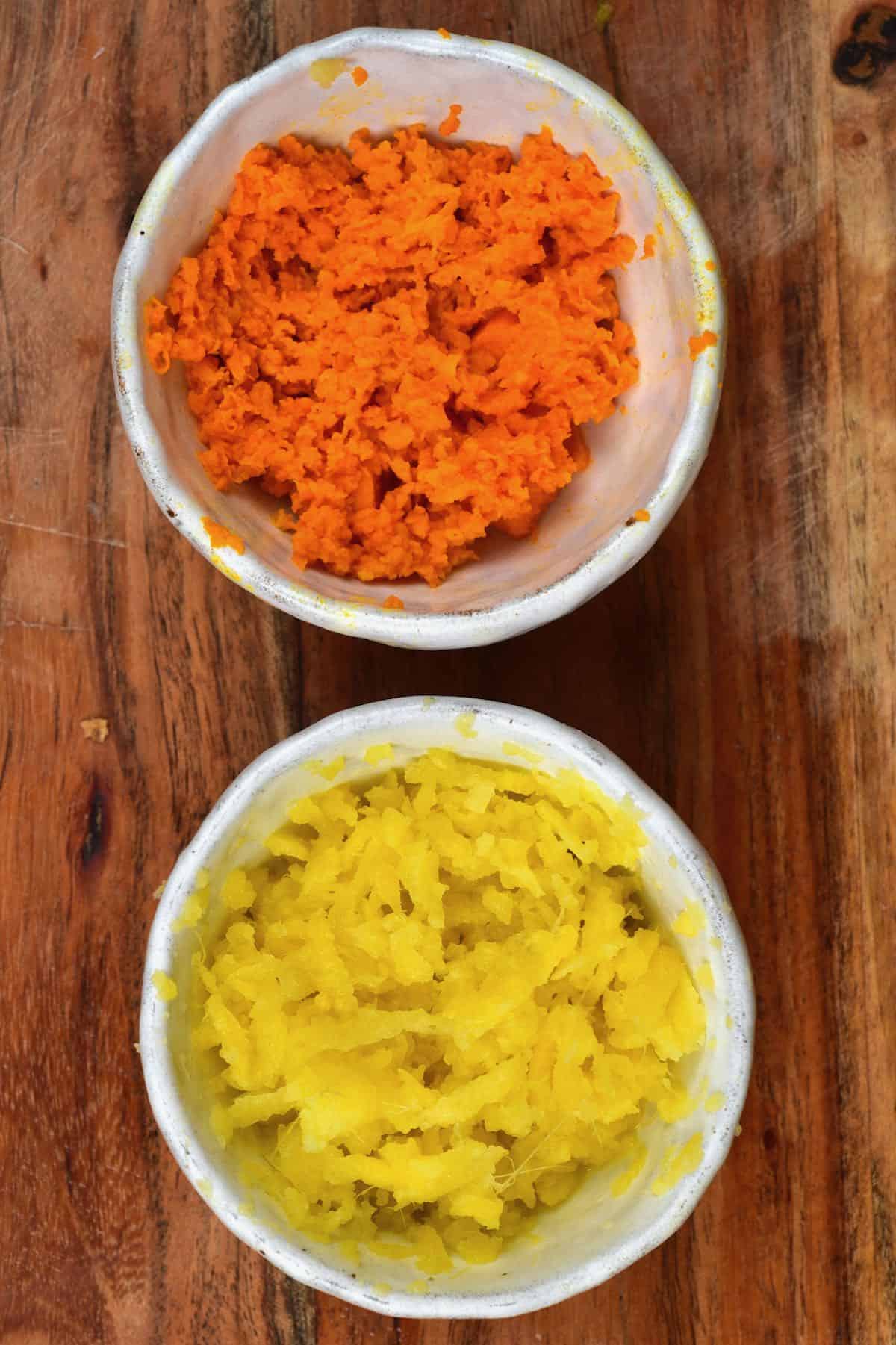 Grated turmeric in a small bowl and grated ginger in another small bowl