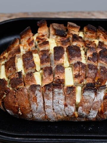 Pull-apart cheese sourdough bread in a baking tray