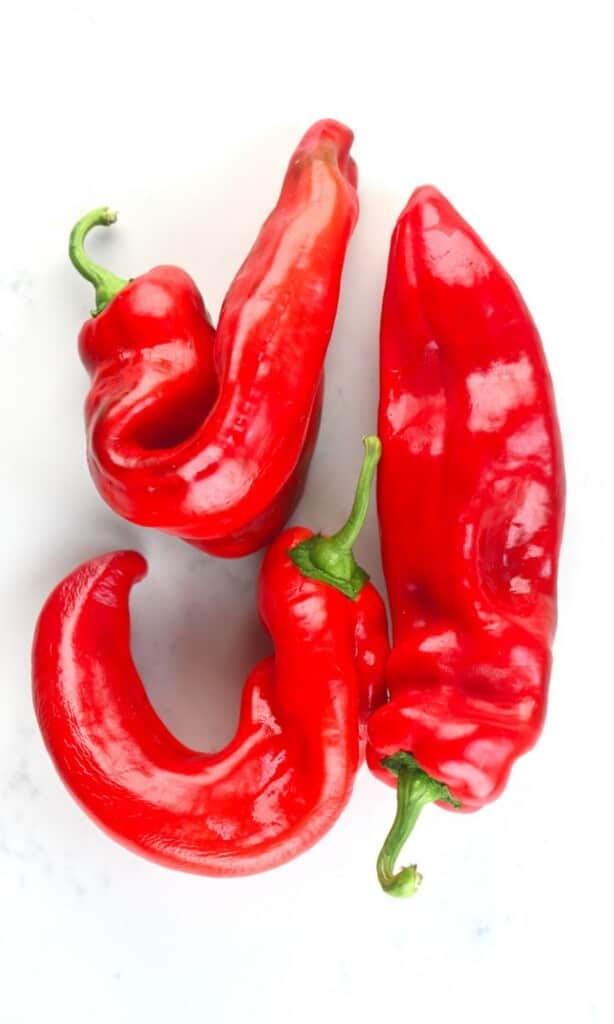 Red peppers on a flat surface