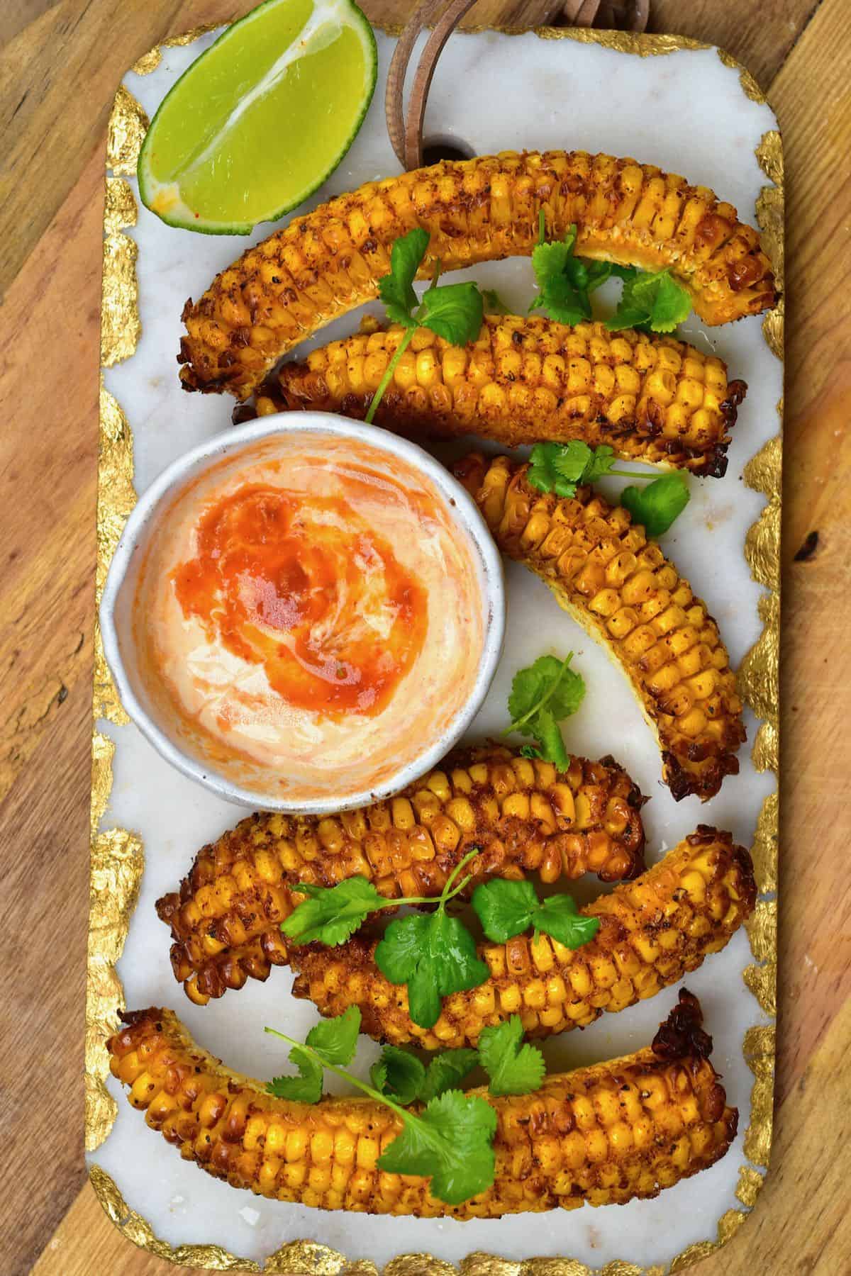 Spicy corn ribs served with chili mayo