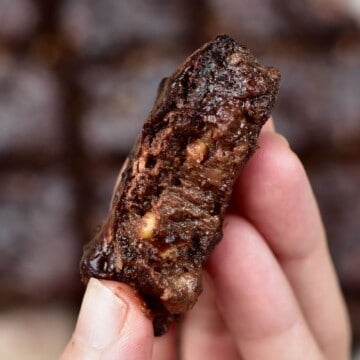 A close up of banana brownies held in a hand