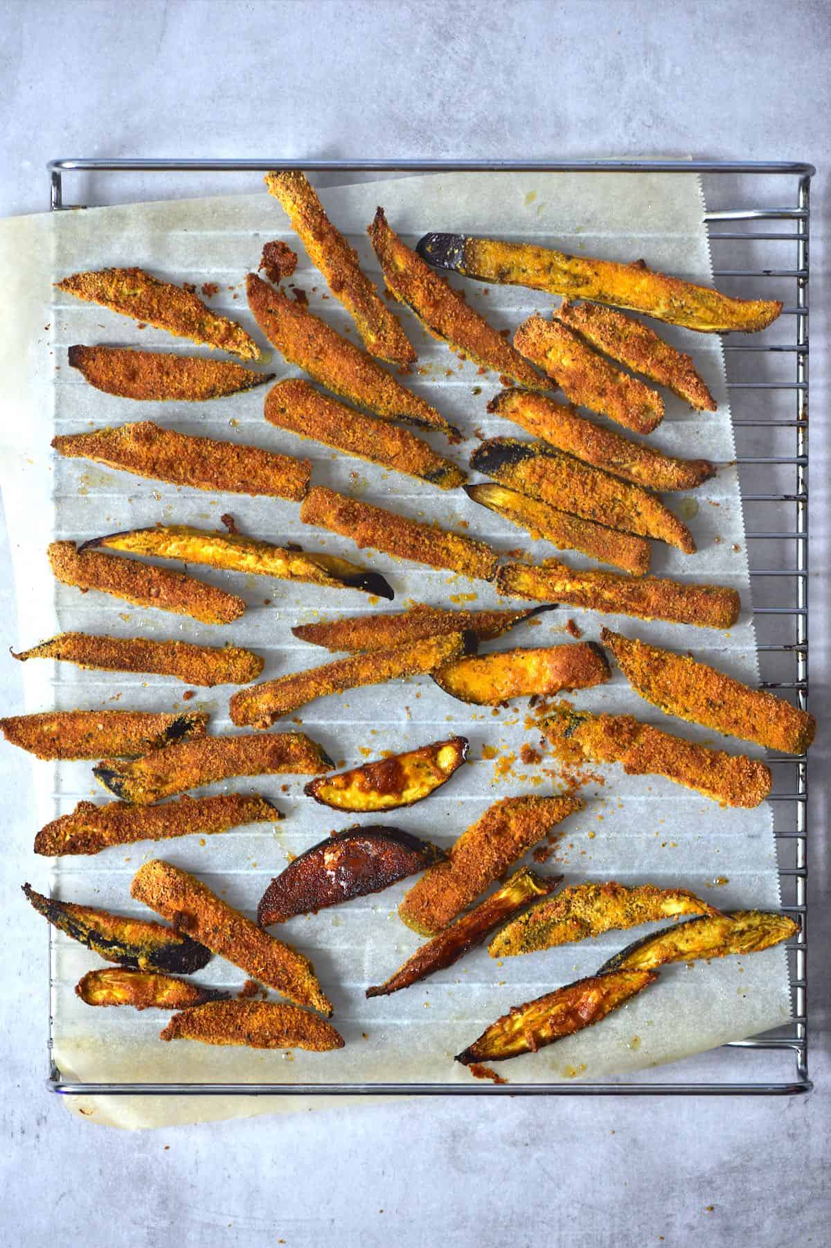 Baked eggplant fries on a baking tray