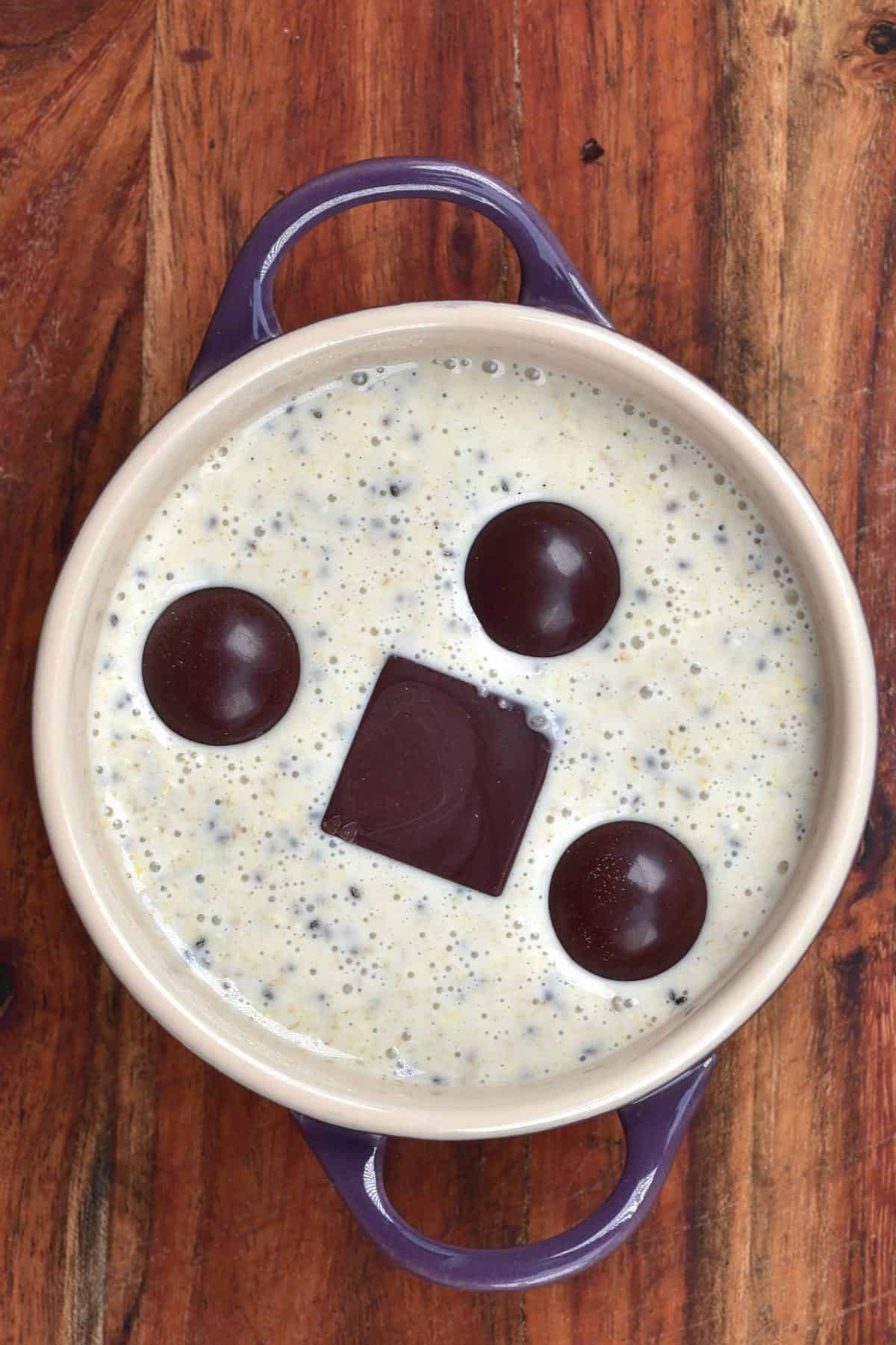 Batter for baked oats with chocolate in a ramekin
