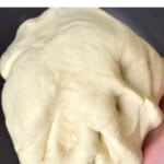 Risen dough in hand