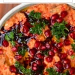 Eggplant Red Pepper Dip topped with parsley and pomegranate seeds