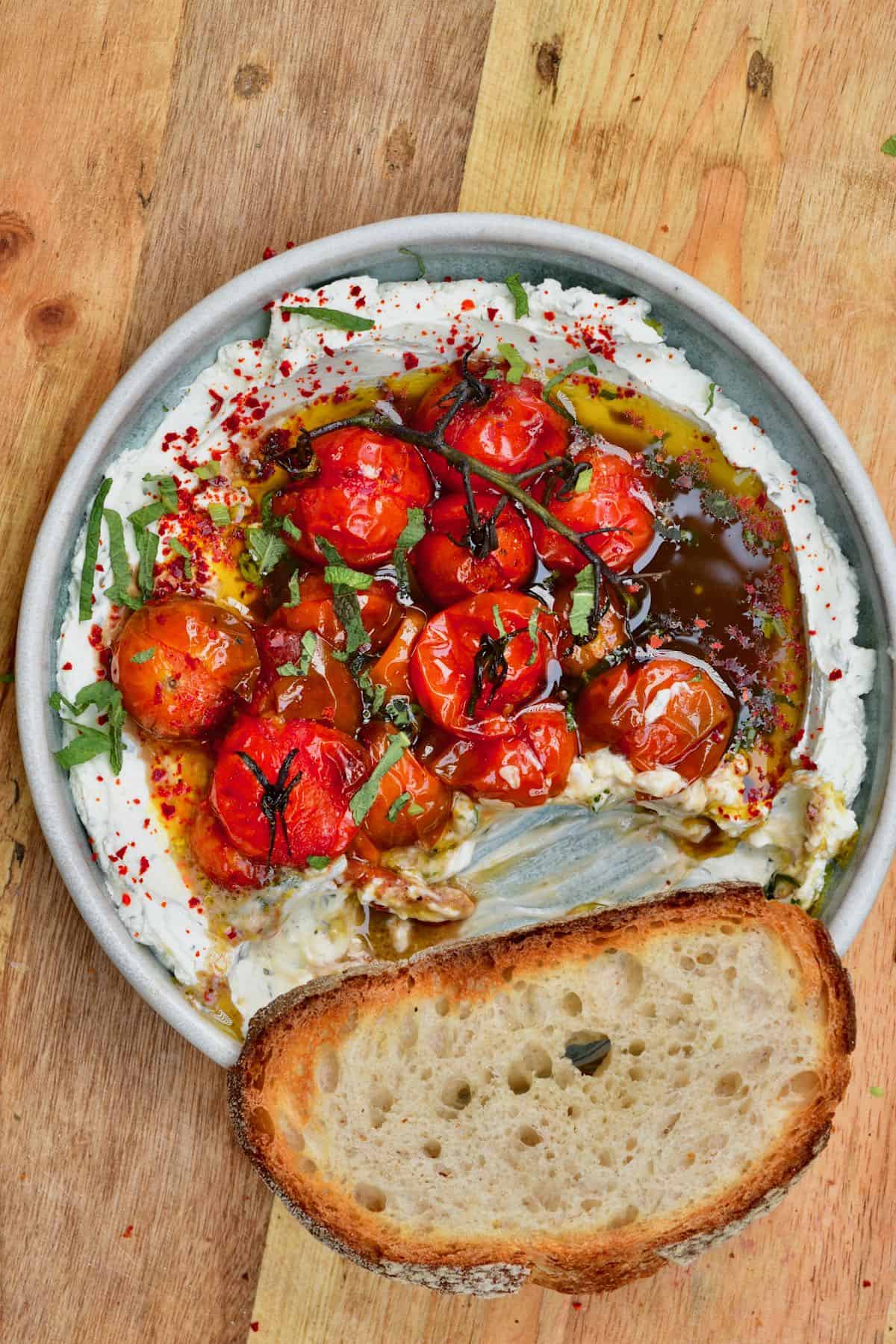 Labneh tomato dip with a piece of bread