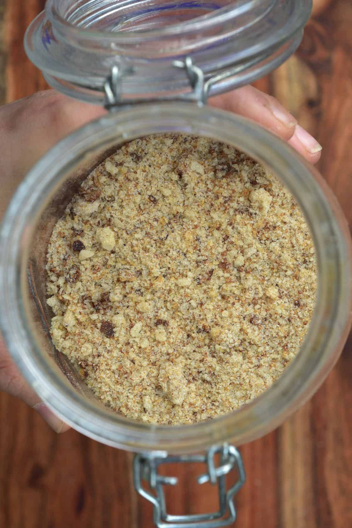 Top view of an open jar filled with breadcrumbs