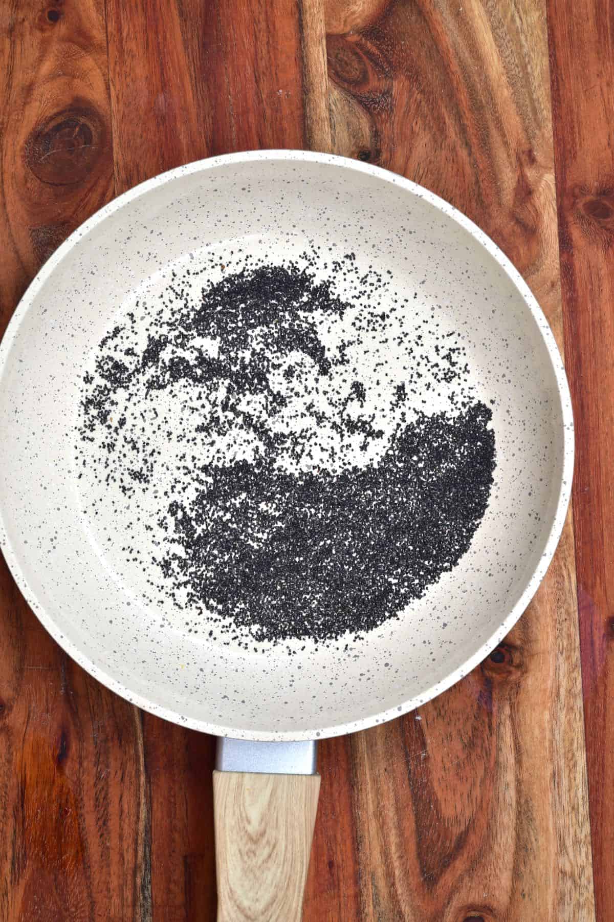 Toasting poppy seeds in a pan
