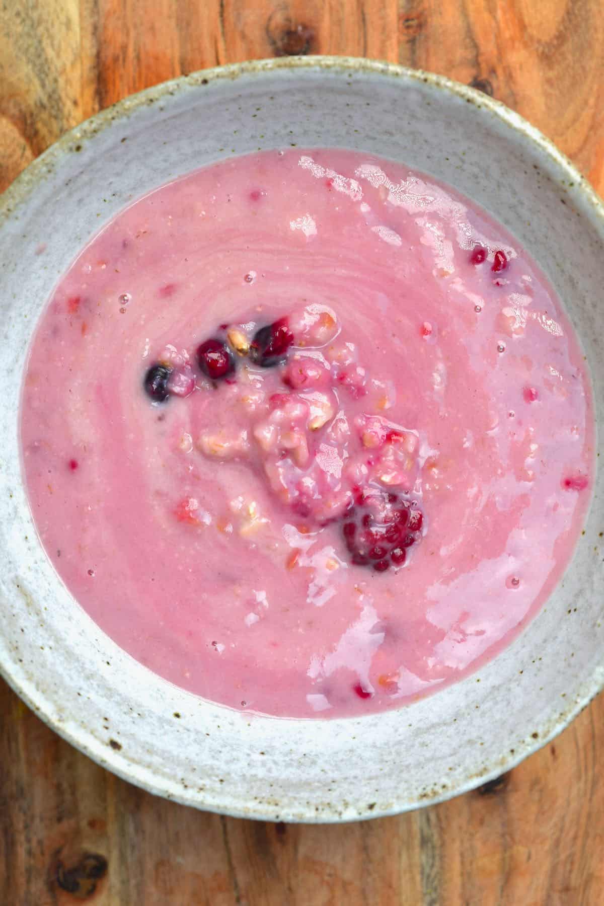Berry oatmeal served in a bowl