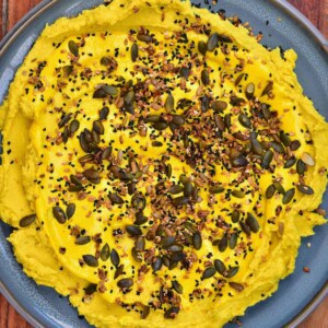 Split pea dip topped with seed mix