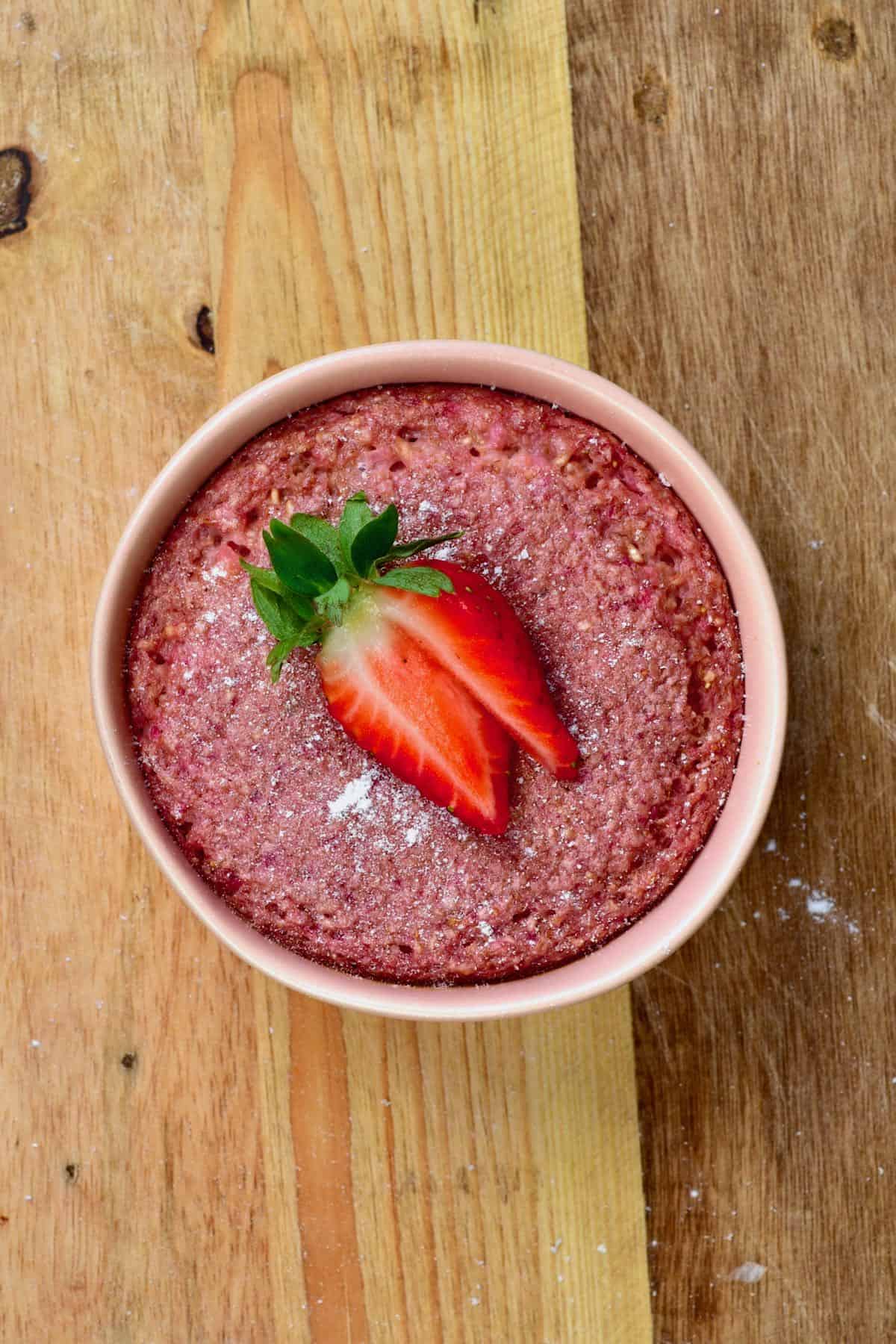 Strawberry baked oats with strawberry on top