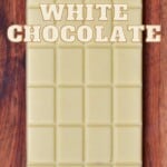 A bar of white chocolate on a wooden surface