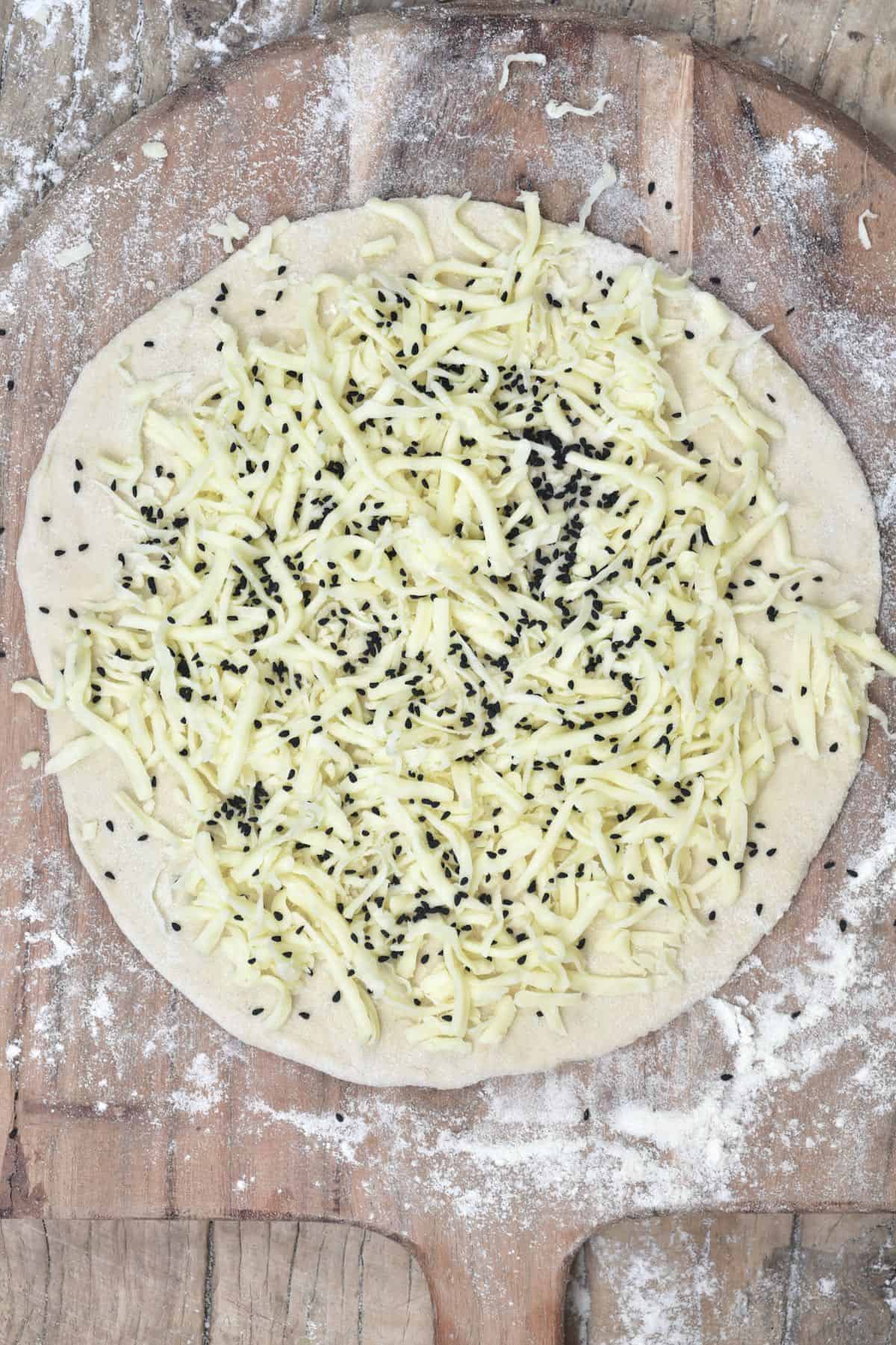 Cheese and seeds manakish ready to bake