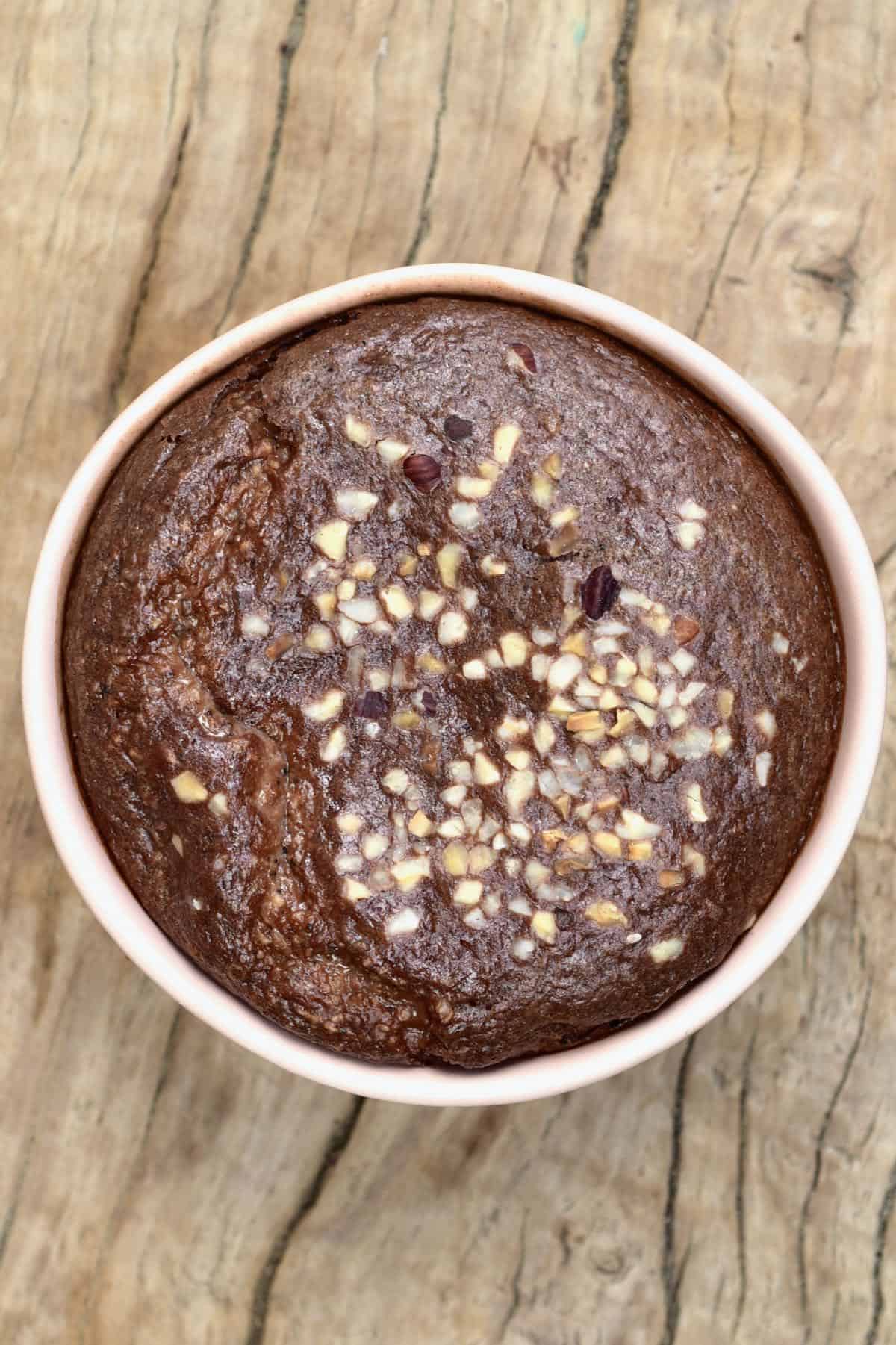 Baked chocolate oats topped with chopped hazelnuts