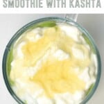 Top view of avocado smoothie topped with yogurt and honey