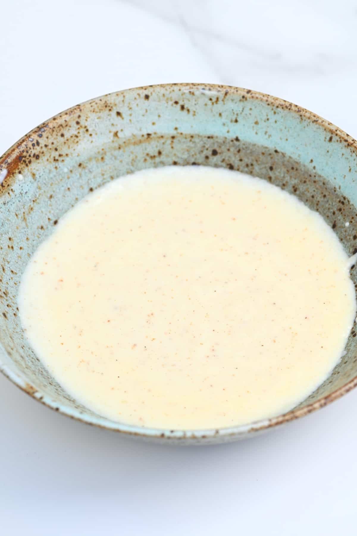 A bowl with bechamel sauce