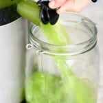Juicing a cucumber with a juicer