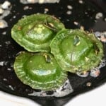 Egg ravioli cooking on a pan - 22