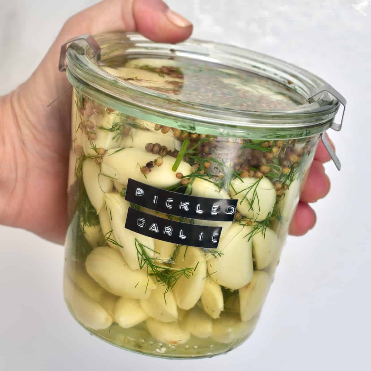 A jar with homemade pickled garlic