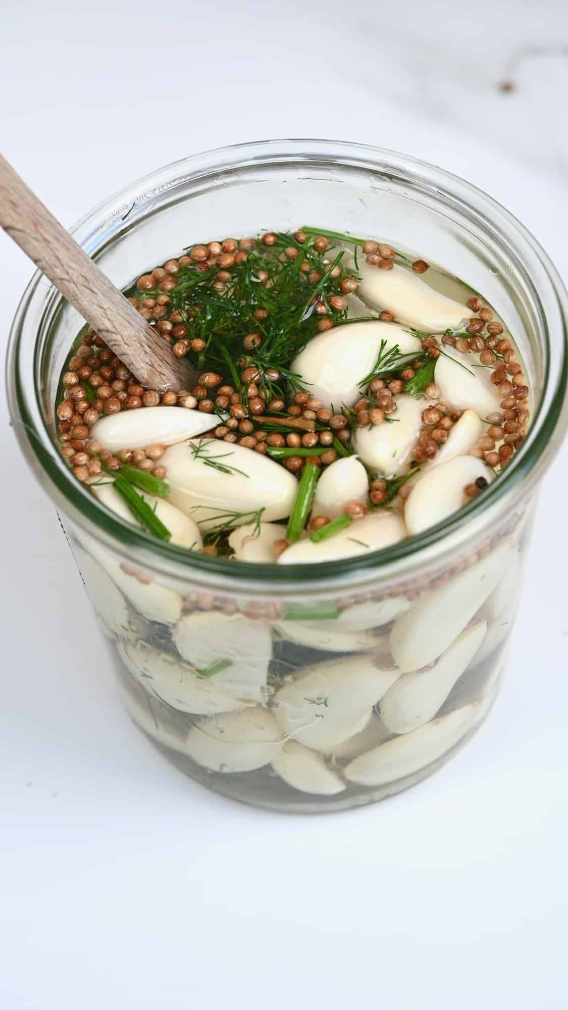 A jar with garlic and brine
