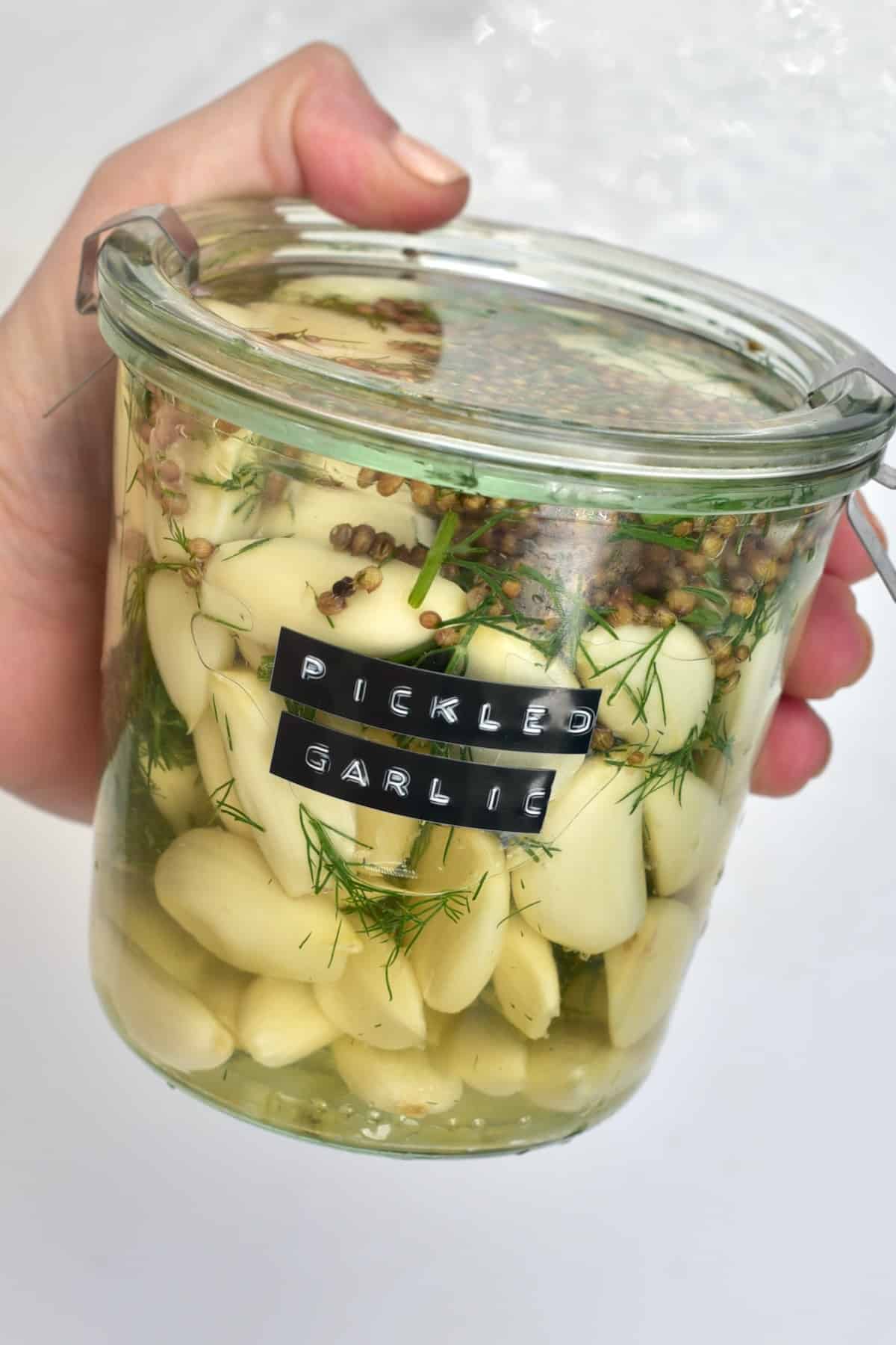 A jar with homemade pickled garlic